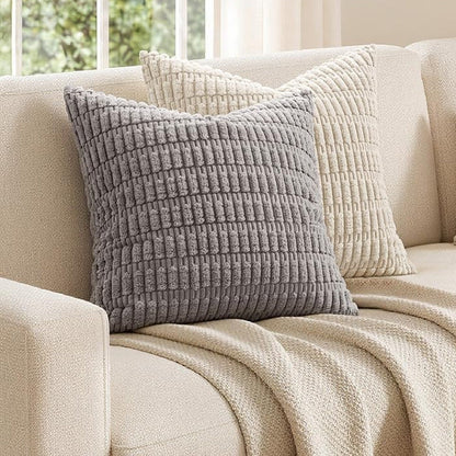 Gray chunky corduroy pillow cover 18x18 in on a cream sofa