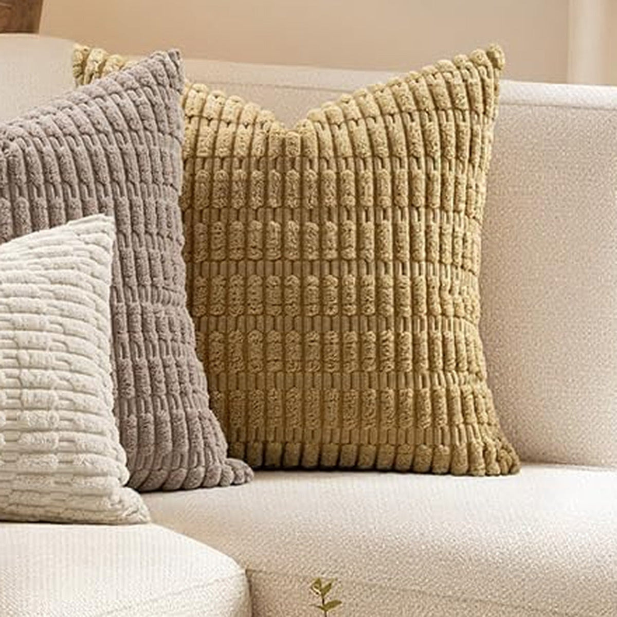 Mustard chunky corduroy pillow cover 18x18 in on a cream sofa